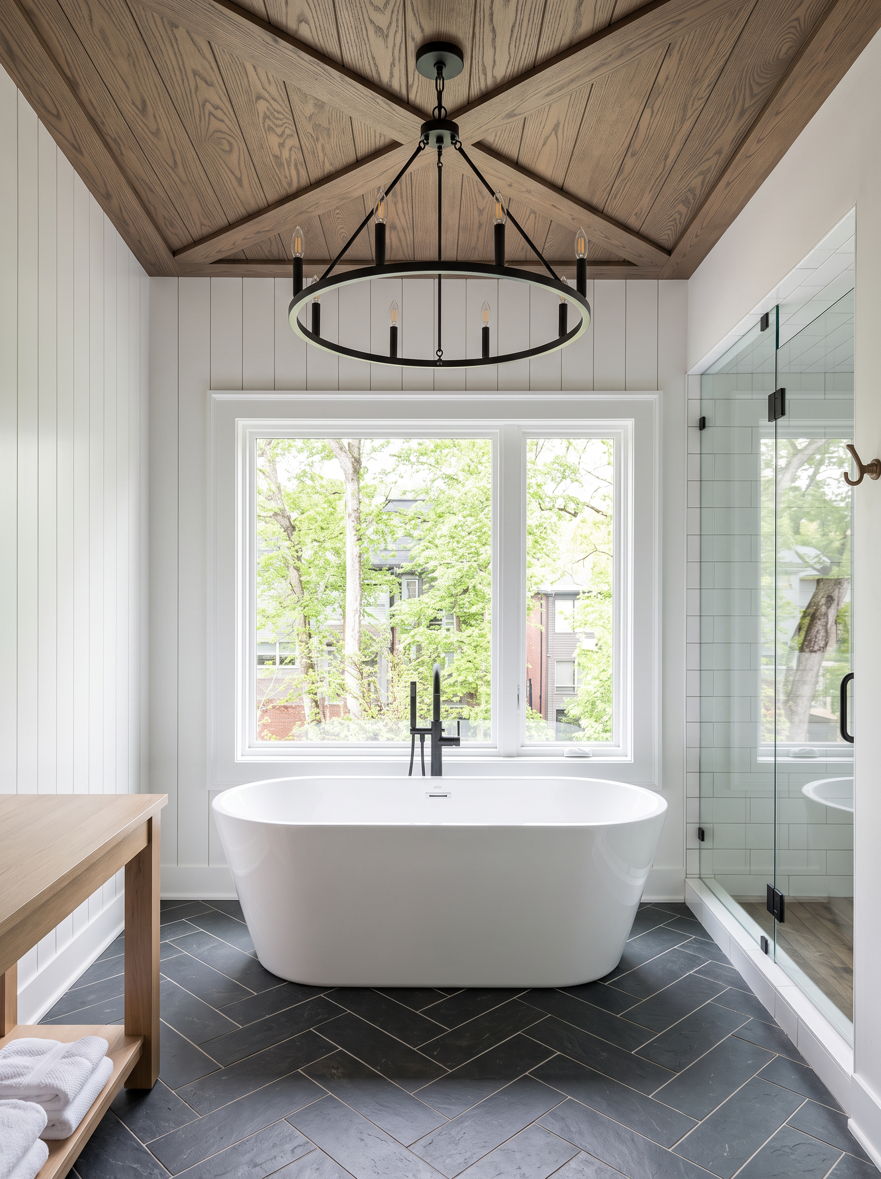 Bathroom with freestanding tub, shiplap walls, and herringbone slate floor